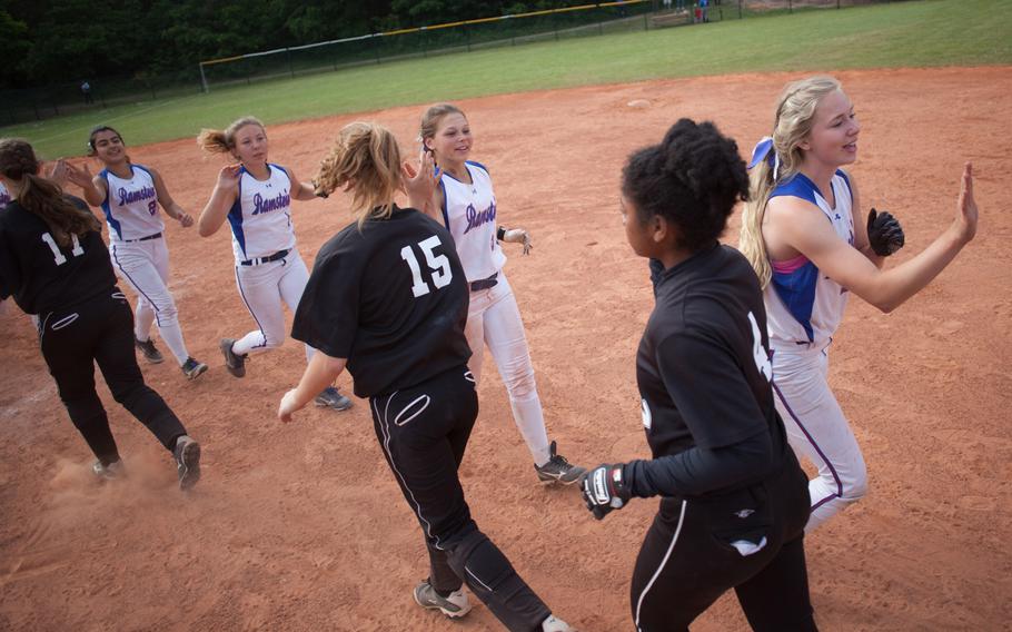 Vilseck and Ramstein high-five after last season's Division I softball title game, which Ramstein won with a razor-thin 7-6 margin.The 2016 DODEA-Europe softball season opens this weekend with a championship rematch.