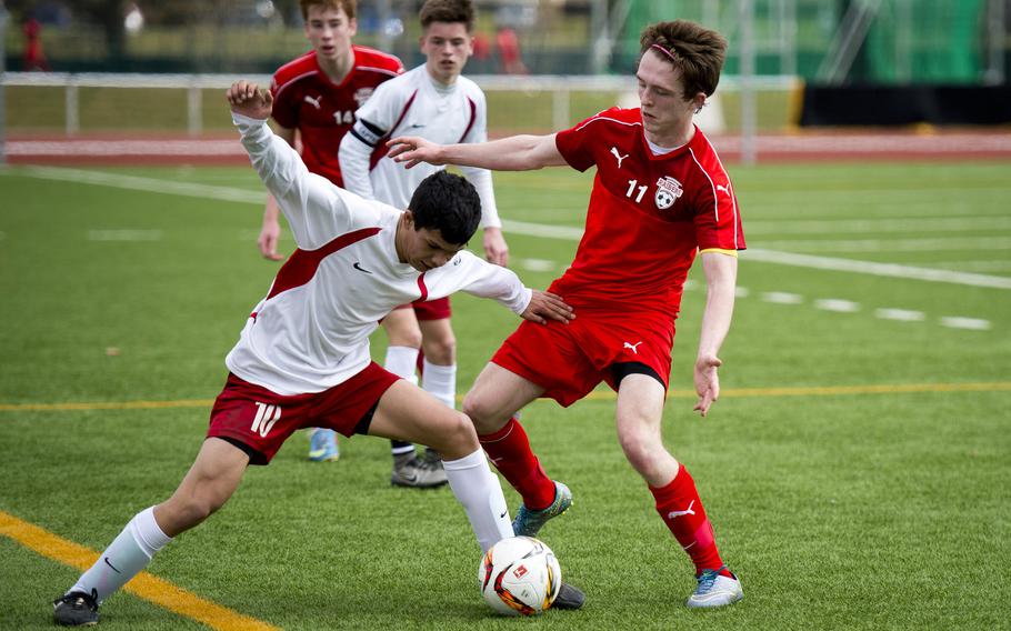 Lakenheath's Tristin Reyes, left, battles Kaiserslautern's Shelton Carter for the ball in Kaiserslautern, Germany, on Saturday, March 26, 2016. Kaiserslautern won 4-0. This weekend Kaiserslautern travels to Stuttgart. Lakenheath was to play Brussels but that game has been cancelled.