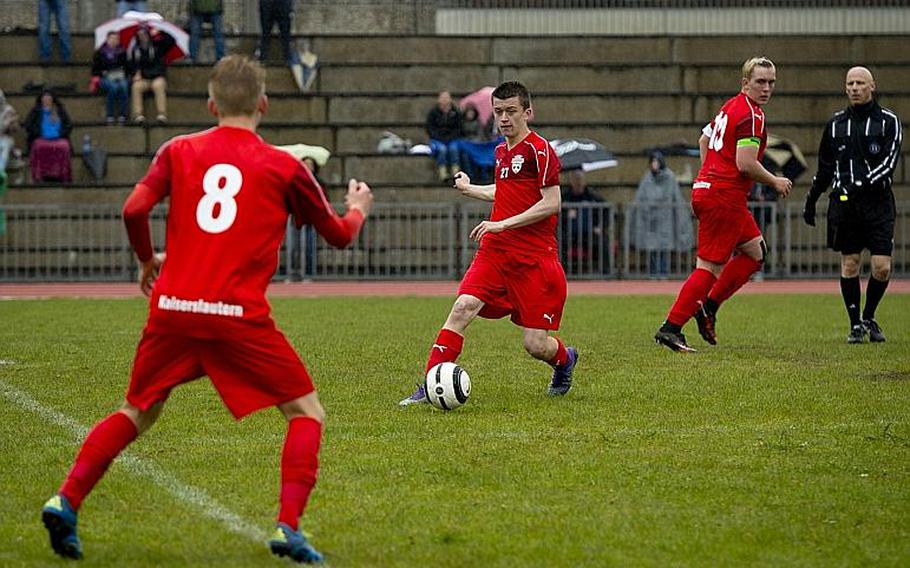 Kaiserslautern's Britain Young, center, passes the ball to Tyler Jankowski during a game against Ramstein at Ramstein Air Base, Germany, on Saturday, April 23, 2016. 