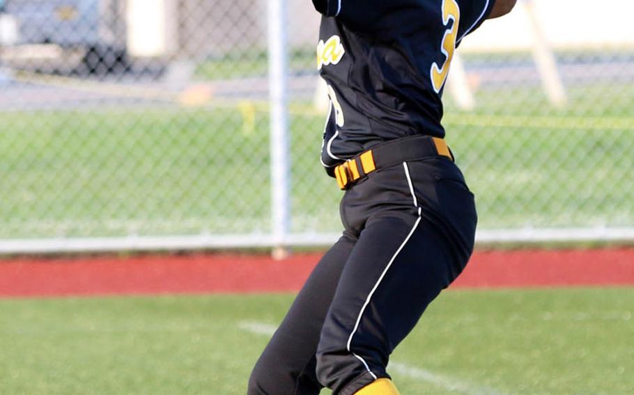 Kadena right-fielder Alex Dunham gets the ball back into the infield.