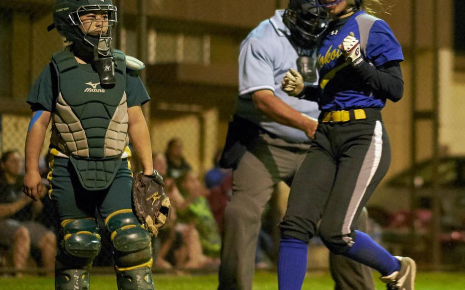 Yokota shortstop Kaia Austin crosses home plate during the Far East Division II Softball Tournament championship game against Edgren at Yokota Air Base, Japan on Wednesday, May 17, 2016. The run would end up being the winning run as Yokota defeated Edgren 3-2 to defend its title.