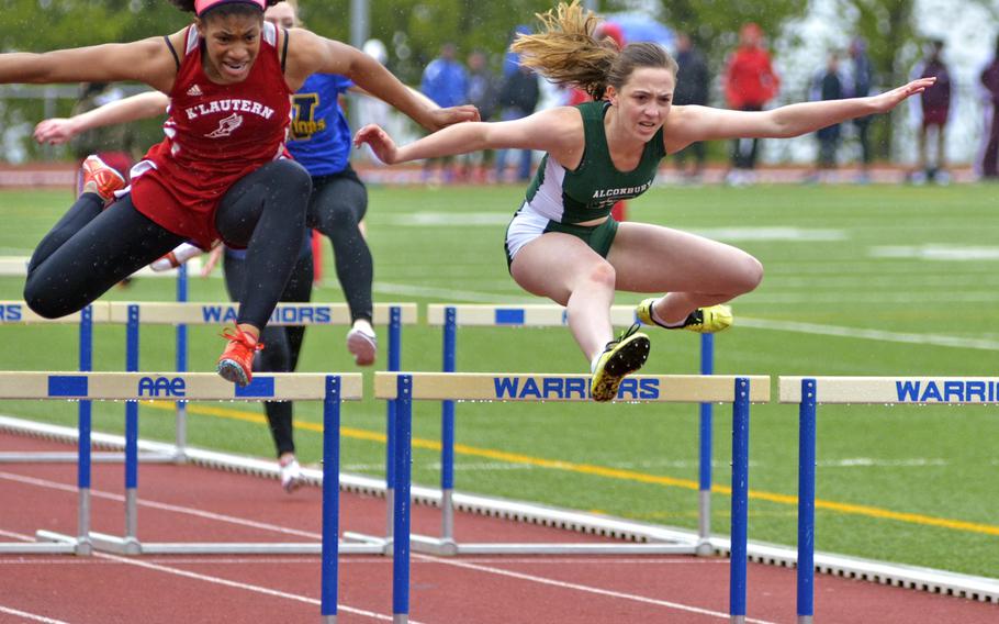 Jada Branch, left, of Kaiserslautern, and Olivia Sealey, right, of Alconbury, contend in the girls' 100-meter hurdles during a ten-team meet at Wiesbaden, Saturday, April 23, 2016. Sealey won the race with a time of 17.52 seconds.