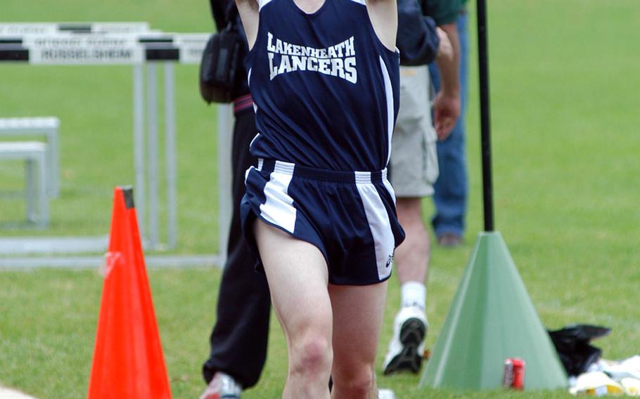 Lakenheath senior Greg Billington celebrates his record-setting victory in the men's 3,000-meter race Friday, May 18, 2007, at the 2007 DODDS Europe track and field championships in Ruesselsheim, Germany.