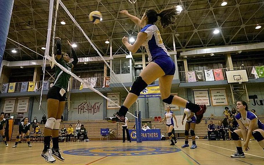 Photo by James Kimber/Stars and Stripes

New Yokota Panthers senior outside hitter Irene Diaz pounds a spike past the defense of Coko Magby of Robert D. Edgren. Diaz, a transfer from Albuquerque, N.M., has averaged 8.7 kills per match for the Panthers, who've gotten off to an 8-1 start.