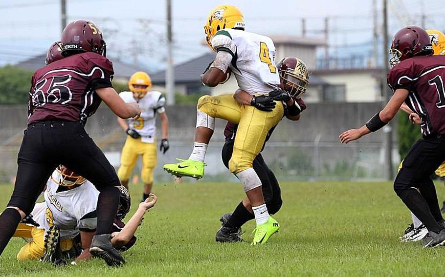 Robert D. Edgren quarterback Patrick Sledge gets hemmed in by Matthew C. Perry's defense on Saturday, Sept. 17, 2016. The game was called late in the second quarter with the Samurai leading 23-0 and the Eagles down to 10 players due to injury.