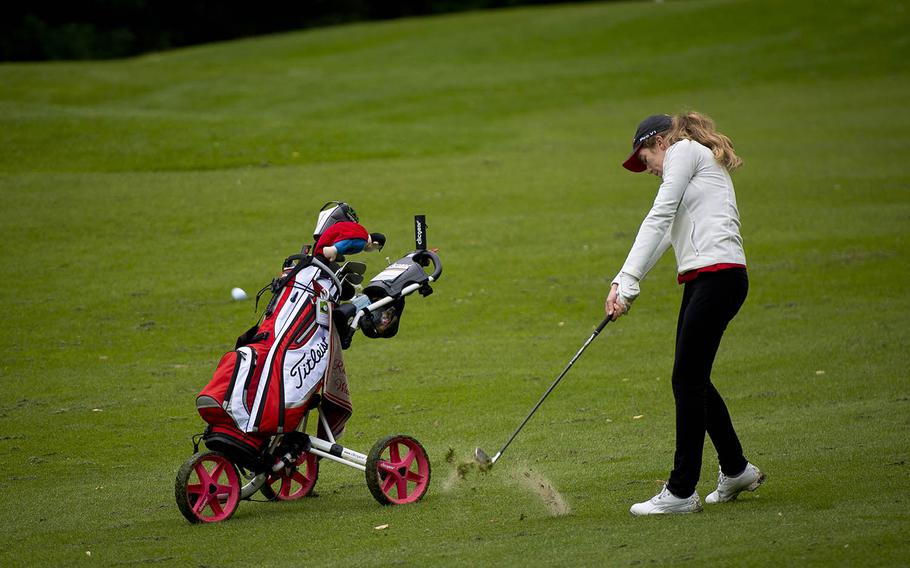 Kaiserslautern's Jasmin Acker takes a shot from the fairway during the DODEA-Europe golf championship at Rheinblick golf course in Wiesbaden, Germany, on Thursday, Oct. 6, 2016.
