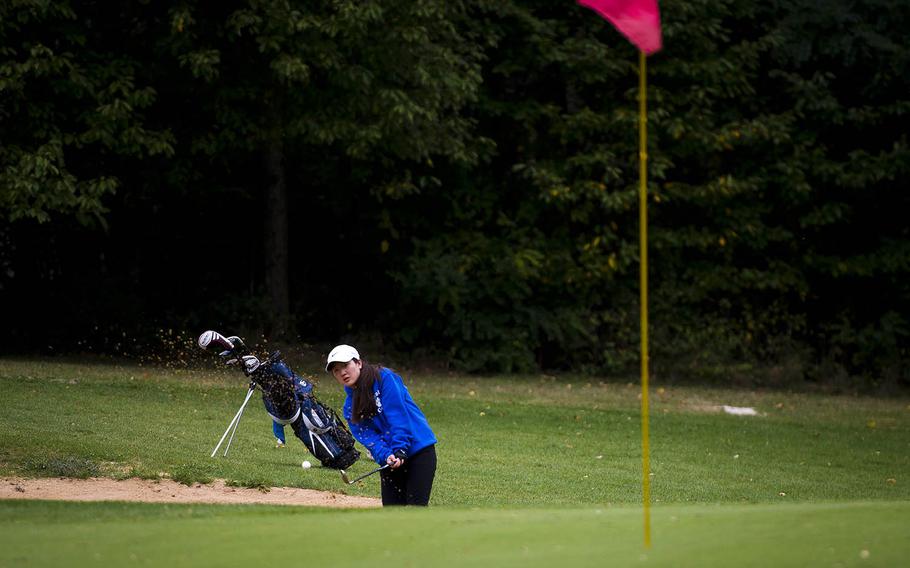 Ramstein's Phoebe Shin chips out of the sand during the DODEA-Europe golf championship at Rheinblick golf course in Wiesbaden, Germany, on Thursday, Oct. 6, 2016.