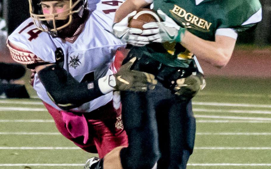 Matthew C. Perry defender Garrett Macias wraps up Robert D. Edgren running back Matt Keating on Friday, Oct. 7, 2016.