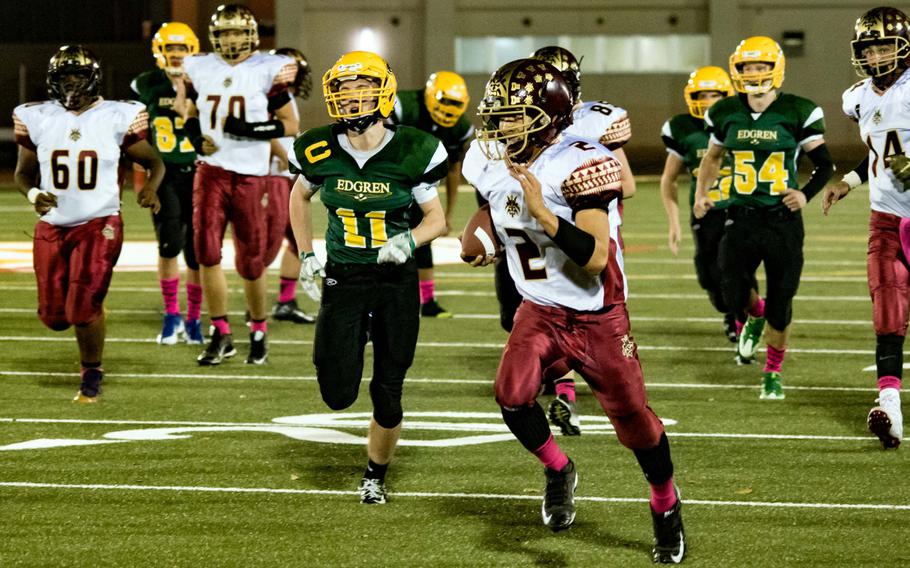 Matthew C. Perry running back Dylan Ernst outruns the pack into the end zone for a fourth-quarter touchdown run Friday, Oct. 7, 2016.