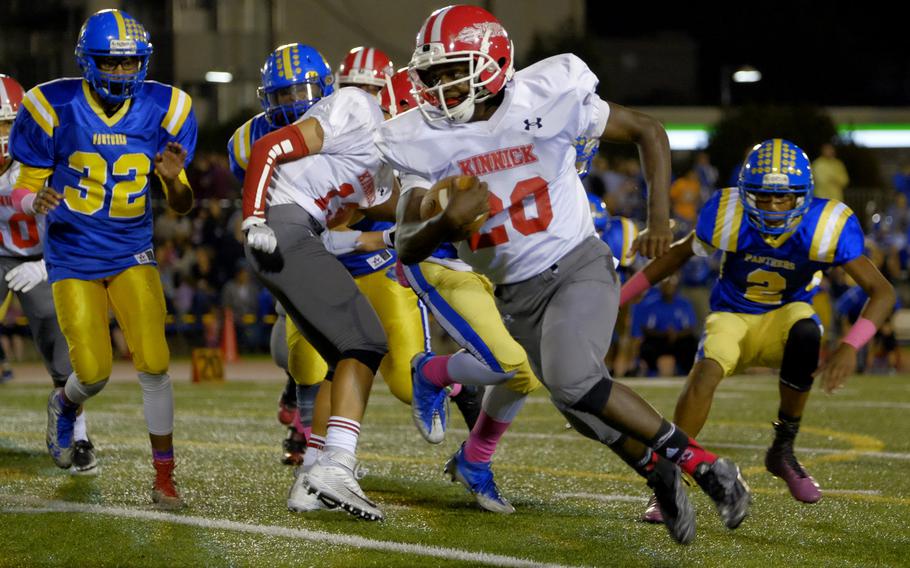 Kinnick running back Chauncey Jamerson rushes in one of his two touchdowns against the host Yokota Panthers Friday, Oct. 7, 2016, at Yokota Air Base, Japan. Kinnick would defeat the Panthers 35-0.