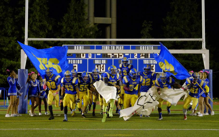 The Yokota Panthers run onto the field for the second half of their homecoming game against the Nile C. Kinnick Devils from Yokosuka, Japan, Friday, Oct. 7, 2016, at Yokota Air Base, Japan. The Panthers would fall 35-0.
