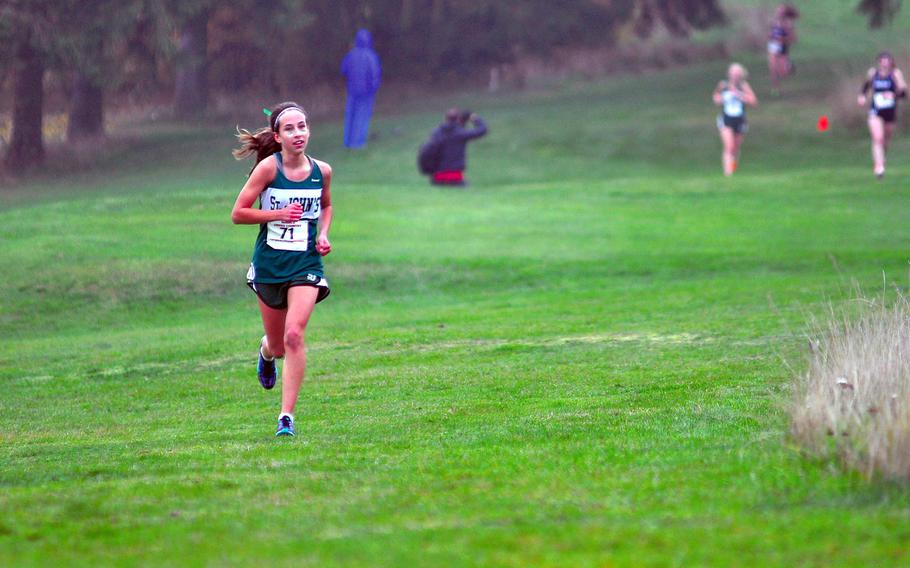 St. John's Kayla Smith widens the gap between her and the rest of the field during last year's DODEA-Europe cross-country championships at Baumholder Army Golf Course in Baumholder, Germany. Smith is the favorite this year at the same location.