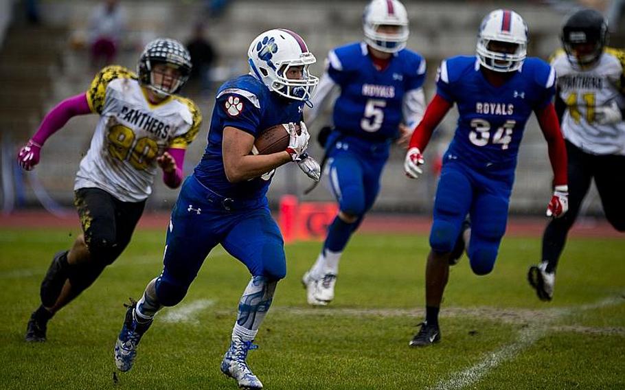 Ramstein's Sidney Boggs runs the ball at Ramstein Air Base, Germany, on Saturday, Oct. 15, 2016. Ramstein defeated Stuttgart 29-0.