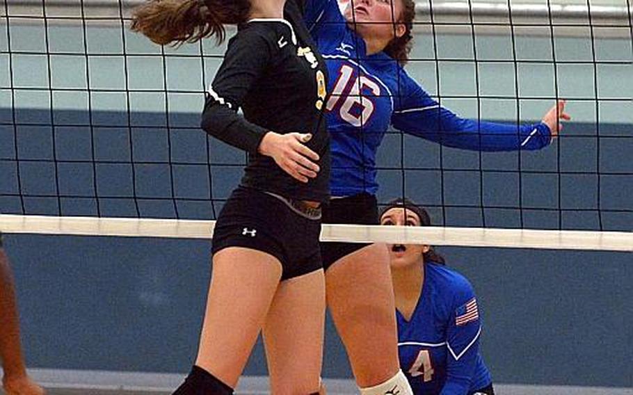 Stuttgart's Alexa Smith, left, and Ramstein's Montgomery Sauter go for the ball in the Division I final at the DODEA-Europe volleyball championships in Kaiserslautern, Germany, Saturday, Nov. 5, 2016. Stuttgart took the title with a 25-18, 25-19, 25-23 win.