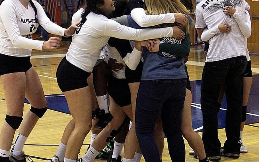 Kubasaki players celebrate their third striaght title in the Far East Division I volleyball tournament. The Dragons are the only DODEA team to win three straight Far East volleyball titles. American School In Japan, titlists from 2011-13, lost to Kubasaki all three times.