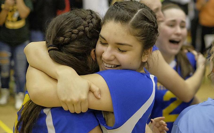 Yokota's Irene Diaz hugs her sister and teammate Adrianna Diaz following the Far East Division II Volleyball championship match Thursday at Yokota Air Base, Japan. The Panthers defeated Christian Academy of Japan 25-11, 25-23, 25-23.