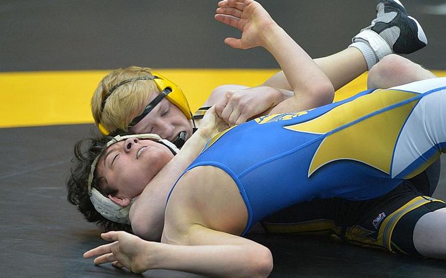 Stuttgart's Benjamin Fielding, rear, has Wiesbaden's Joey Krapf in his grip on his way to winning the first-round 120-pound match at the DODEA-Europe wrestling championships in Wiesbaden, Germany, Friday, Feb. 19, 2016.

Michael Abrams/Stars and Stripes