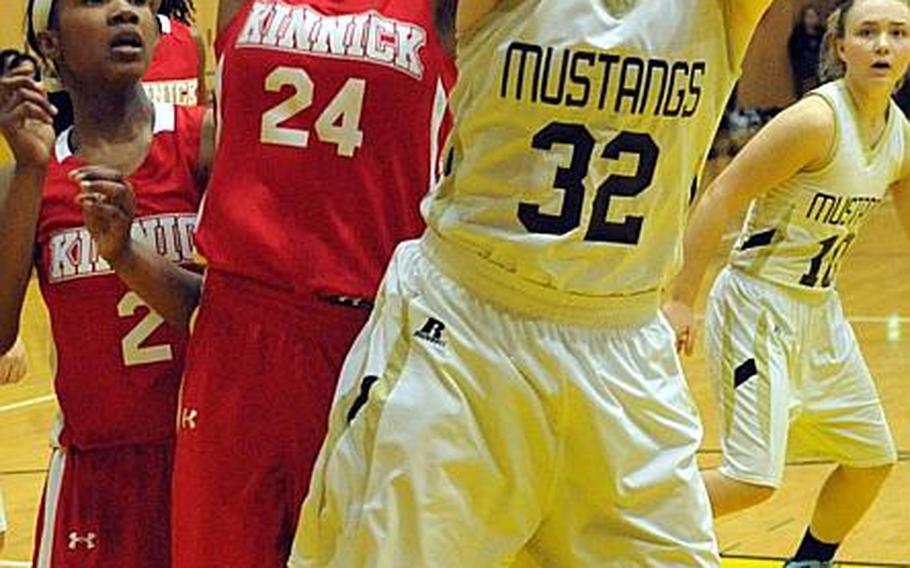 Nile C. Kinnick's Dallas Carter, left,  and American School In Japan's Grace Wallrapp figure to be key cogs as the Red Devils and Mustangs take the role of teams to beat in the girls D-I tournament.