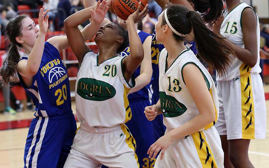 Robert D. Edgren's Christina Taylor tries to shoot through mass traffic including teammates and Yokota defenders during Thursday's Far East Girls Division II Tournament final, won by the three-time champion Panthers 42-35.