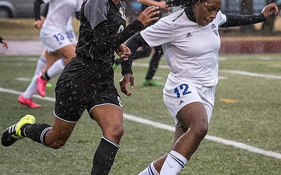 Yokota's Jamia Bailey, chased down by Zama's Kayesha McNeil, is one of three juniors whom Panthers coach Matt Whipple calls the "strikee force" for the two-time defending Far East Division II tournament champions.