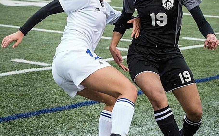 Yokota's Regina Dukat, battling for the ball with Zama's Armelia Baldwin, is one of three juniors whom Panthers coach Matt Whipple calls the "strike force" for the two-time defending Far East Division II tournament champions.