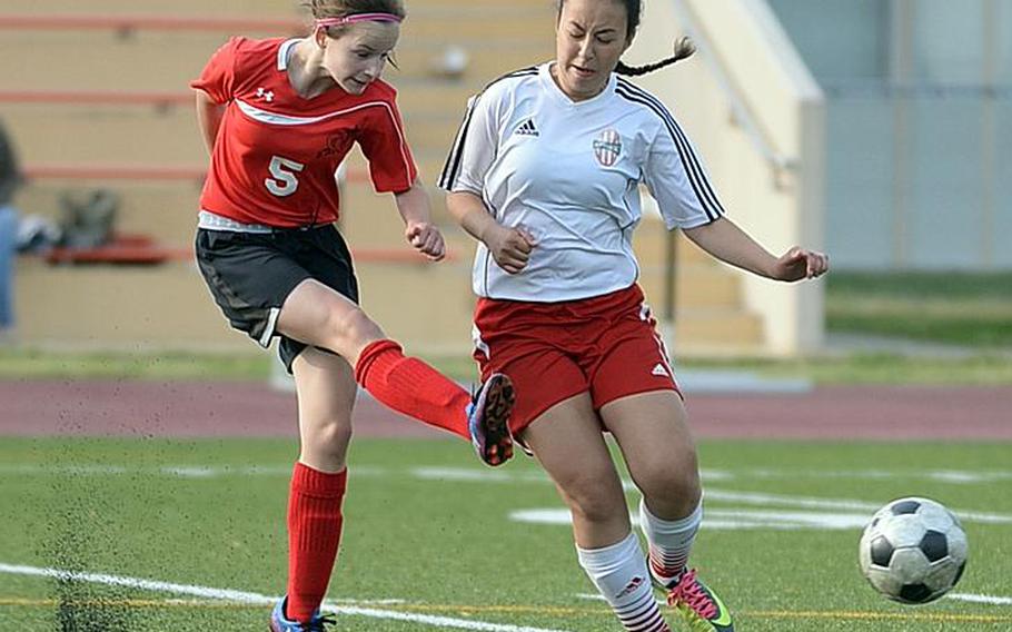 Freshman Gabriella Shultz, booting the ball past Nile C. Kinnick's Riassa Guenther, has 11 goals thus far this season for E.J. King girls soccer, five more than the old career mark of six set by Nickie Phousongphouang.