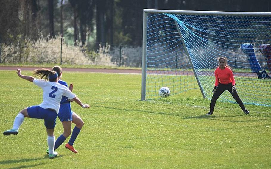 Hohenfels Nicole Pineiro-Serrano shoots against Brussels goalkeeper Gloria Hernandez, and scores, during a game at Hohenfels on Friday, April 21, 2017.