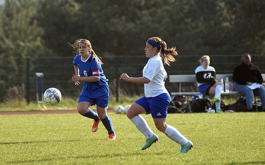 Hohenfels Nicole Pineiro-Serrano races to the ball against Brussels' Juliette Mobley during a game at Hohenfels on Friday, April 21, 2017.