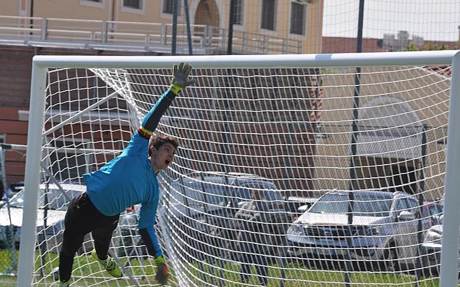 Vilseck goalkeeper Tim Simmons goes flying to try to stop a goal in the Falcons' 2-1 loss to Vicenza on Friday.