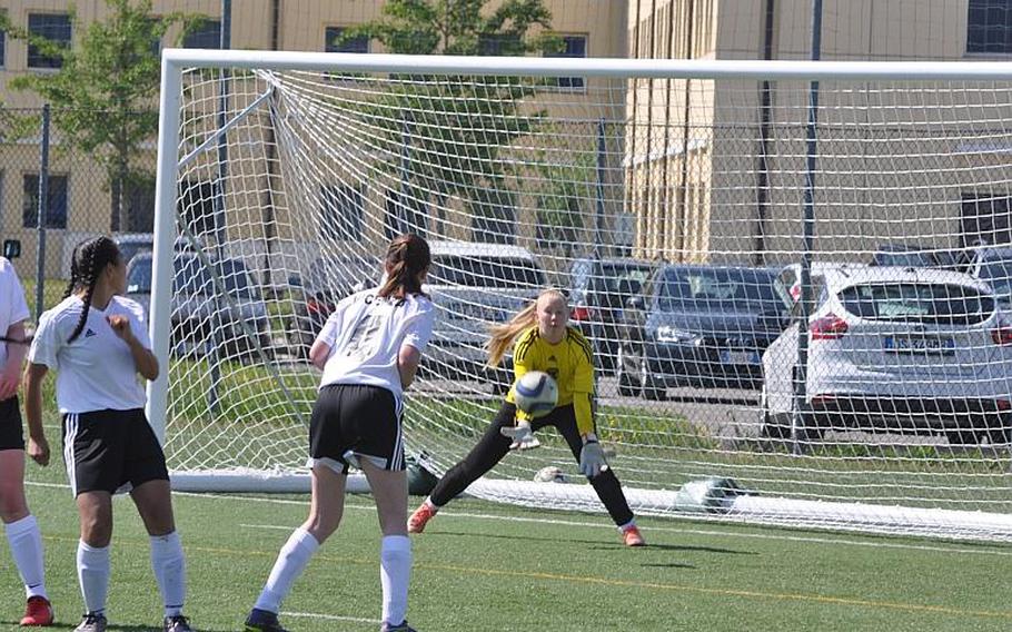 Members of a wall of Vicenza defenders turn around to watch goalkeeper Rhiannon Merkel catch a free kick and prevent a goal Friday in the Cougars' 2-0 victory over Vilseck.