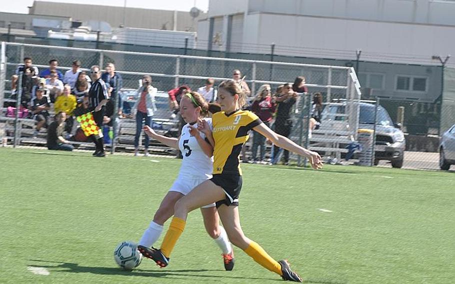 Naples' Shiloh Houseworth and Stuttgart's Alexa Smith battle for the ball Friday in the Panthers' 8-2 victory over the Wildcats. Smith scored three times.