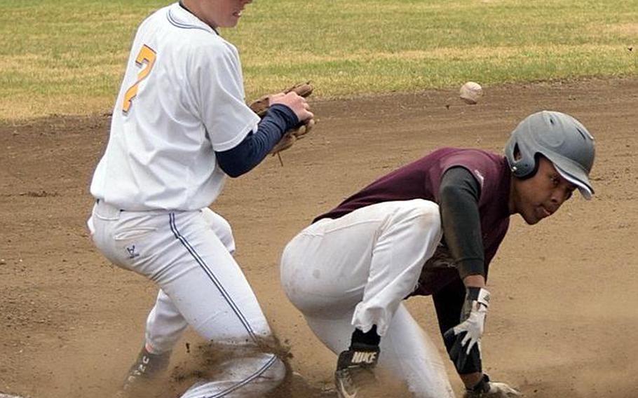 Yokota's Nathan Rundle tries to get a handle on the ball as Zama's Donnie McNeill slides safely into third base during Saturday's DODEA-Japan baseball tournament game. The Panthers won 11-2 and repeated as tournament champions with a 4-0 record.