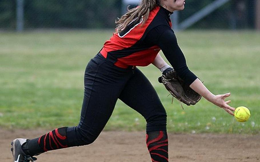 Nile C. Kinnick shortstop Faith Hughes makes an underhand toss to second to force out an E.J. King baserunner during Saturday's DODEA-Japan softball tournament championship game. The Red Devils won 18-6, rallying from a 6-2 second-inning deficit.