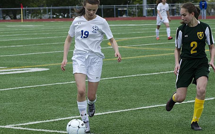 Wiesbaden winger Kendal Stopinski dribbles against SHAPE's Kalea Robleda in the second half of their match Saturday, April 22, 2017, in Wiesbaden, Germany. Stopinski scored Wiesbaden's first goal en route to a 2-0 victory over the Spartans.