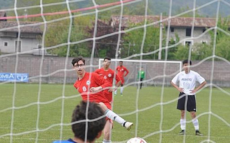 Aviano goalkeeper Giacommo Fabbro guesses correctly to stop a penalty kick from American Overseas School  of Rome's Bar Poleg as the two teams tied 0-0 Saturday.