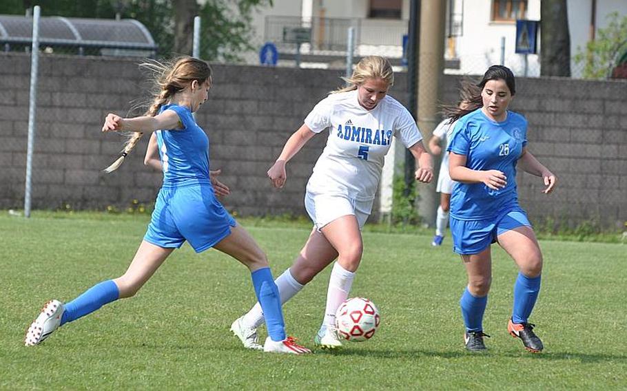 Marymount's Matilde Di Tommaso, left, and Elena Levantini try to get the ball away from Rota's Megan Shaw during a rare regular-season DODEA-Europe soccer match for the Admirals, who played three games in two days with 30-hour bus rides on either side of the trip.