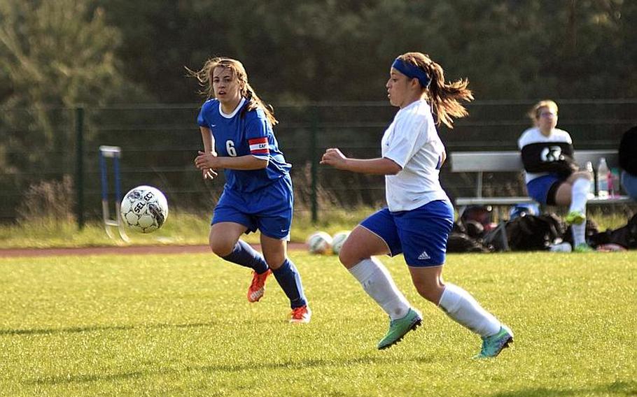 Hohenfels' Nicole Pineiro-Serrano races to the ball against Brussels Juliette Mobley during a game at Hohenfels High School, Friday, April 21.