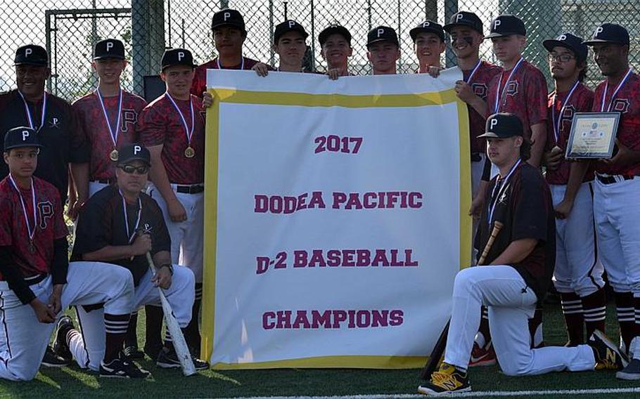 Matthew C. Perry players gather round the banner after beating Yokota 2-1 for the first Far East Division II Baseball Tournament title in school history.

CHARNISE KEY/SPECIAL TO STRIPES