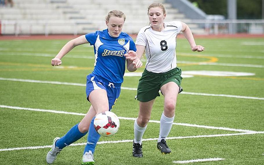 Sigonella's Violender Doke, left, and Alconbury's Haley Starr race for the ball during the DODEA-Europe Division III championship in Kaiserslautern, Germany, on Saturday, May 20, 2017. Sigonella lost the match 1-0 in overtime.

MICHAEL B. KELLER/STARS AND STRIPES