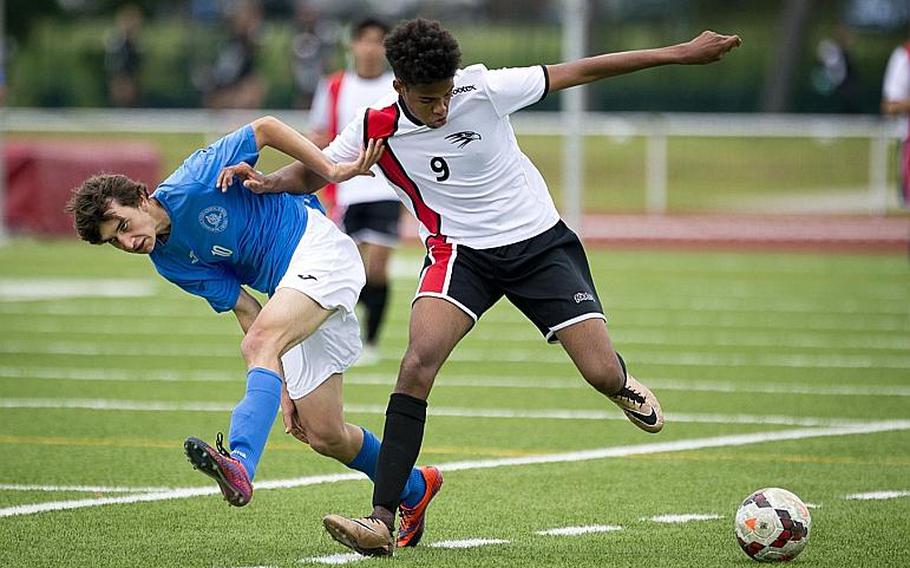 American Overseas School of Rome's Gabriel Smith, right, challenges Marymount's Arturo Forcella for the ball during the DODEA-Europe Division II championship in Kaiserslautern, Germany, on Saturday, May 20, 2017. AOSR lost the match 3-2 in overtime.

MICHAEL B. KELLER/STARS AND STRIPES