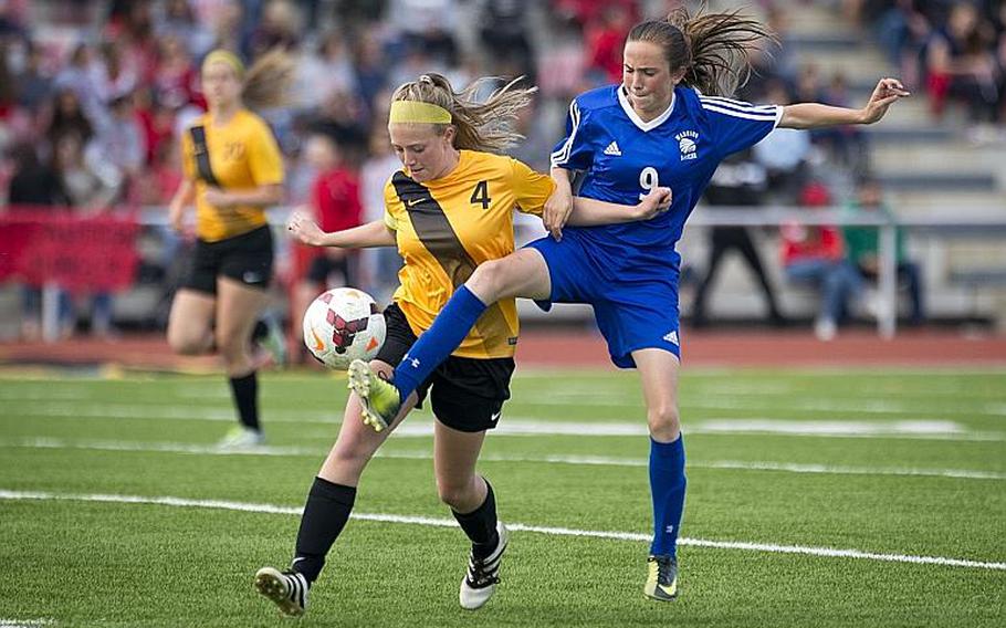 Wiesbaden's Erin Goodman, right, tries to get the ball away from Stuttgart's Katie Graham during the DODEA-Europe Division I championship in Kaiserslautern, Germany, on Saturday, May 20, 2017. Wiesbaden won the title match in a 3-0 shootout.
