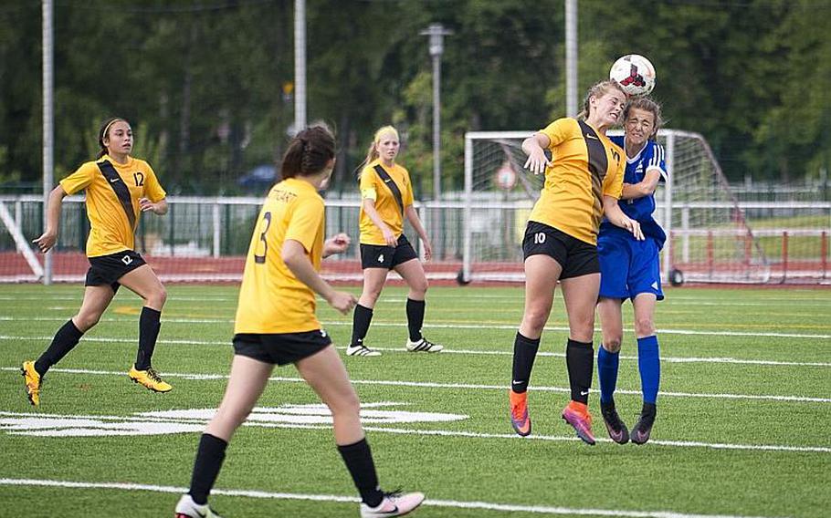 Wiesbaden's Lily Hogenson, right, and Stuttgart's Lexi McLellan jump for a header during the DODEA-Europe Division I championship in Kaiserslautern, Germany, on Saturday, May 20, 2017. Wiesbaden won the title match in a 3-0 shootout.

