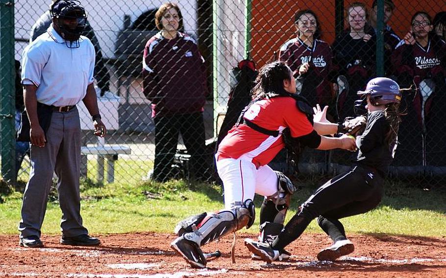 Kaiserslautern's Christine Capalar tags out Vilseck's Natasha Murray before she can score Saturday, but plenty of Falcons did score in a 12-3, 12-1 doubleheader sweep.
MARTIN EGNASH/STARS AND STRIPES
