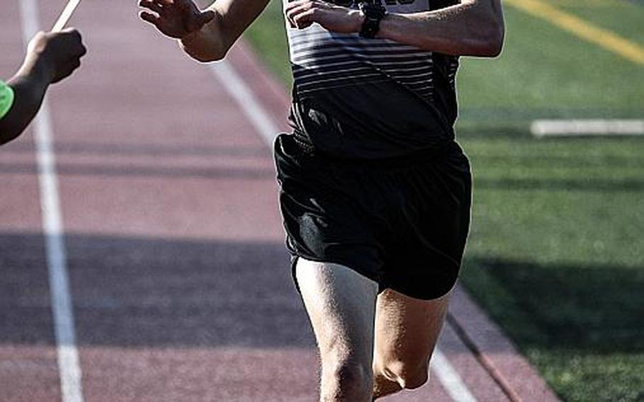 Zama senior Hunter Lund crosses the finish line in record time in the Far East boys 3,200-meter run, in which he was timed in 9 minutes, 43.44 seconds, topping the old mark of 9:57.80 set a year ago by Yokota's Daniel Galvin.

JACK HIGBEE/SPECIAL TO STRIPES