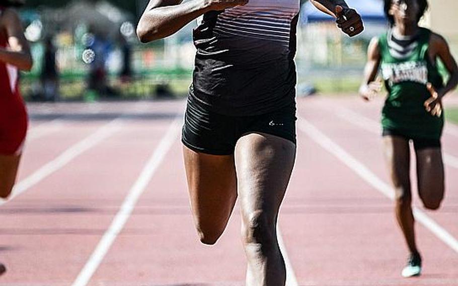 Zama senior Tasia Nelson crosses the finish line in Far East meet record time in the 200; she clocked 25.56 seconds, breaking the previous mark of 25.73 set two years ago.

JACK HIGBEE/SPECIAL TO STRIPES