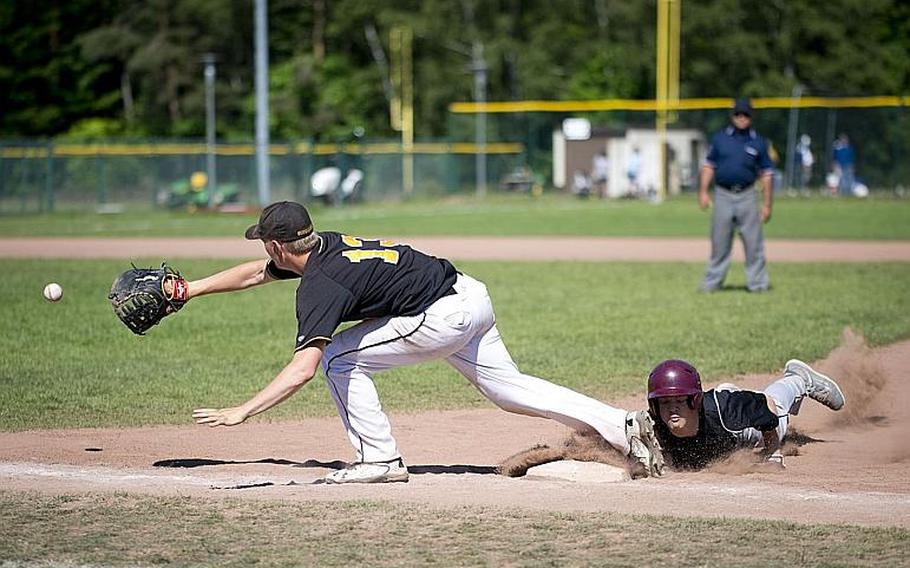 Vilseck's Christian Brashears, right, slides into first ahead of a throw to Stuttgart's Will Green during the DODEA-Europe baseball tournament at Ramstein Air Base, Germany, on Friday, May 26, 2017. Vilseck lost the Division I game against Stuttgart 9-0.
MICHAEL B. KELLER/STARS AND STRIPES