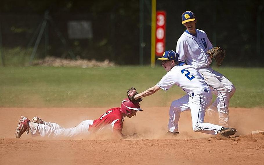 Wiesbaden's Parker Crumbly, right, tags out Kaiserslautern's Caleb Moffat at second during the DODEA-Europe baseball tournament in Kaiserslautern, Germany, on Friday, May 26, 2017. Wiesbaden won the Division I game 11-7 and advances to the semifinals.

MICHAEL B. KELLER/STARS AND STRIPES