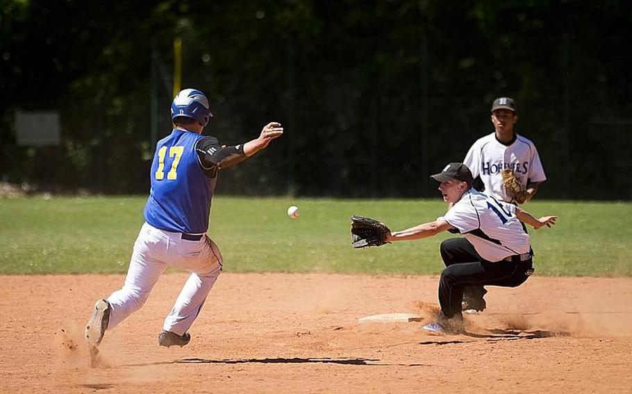 Sigonella's Alex Ogletree, left, tries to slide into second before a throw to Hohenfels' Gabe D'Amato during the DODEA-Europe baseball tournament in Kaiserslautern, Germany, on Friday, May 26, 2017. Sigonella won the game 14-3 and advances to the semifinals.

MICHAEL B. KELLER/STARS AND STRIPES