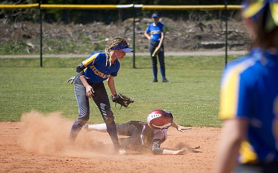 Wiesbaden's Grace Turner, left, tags Kaiserslautern's Phoenix Whisennand out at second during the DODEA-Europe softball tournament at Ramstein Air Base, Germany, on Friday, May 26, 2017. Wiesbaden lost the game 10-5.

MICHAEL B. KELLER/STARS AND STRIPES