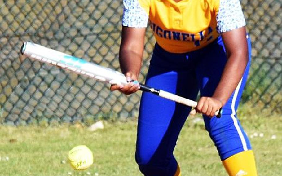 Sigonella's Latatayana Jefferson bunts the ball during a game against Rota during the second day of the softball championships at Kaiserslautern, Friday, May 26.